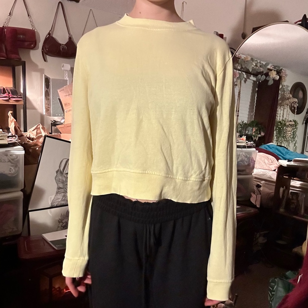 Pale yellow crewneck sweatshirt